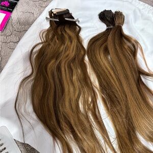 A mix of new and used Donna Bella tape in extensions. 16-18”